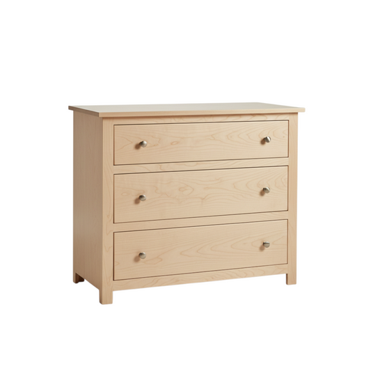 Wooden dresser with four drawers on a white background