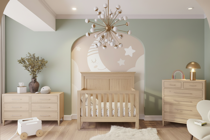 Nursery room with wooden crib, dresser, and decorative wall art.