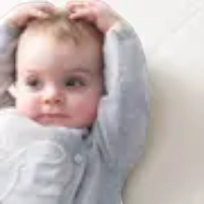 Modugreen Baby breathable organic cotton crib mattress cover with a quilted surface, shown with a happy baby.