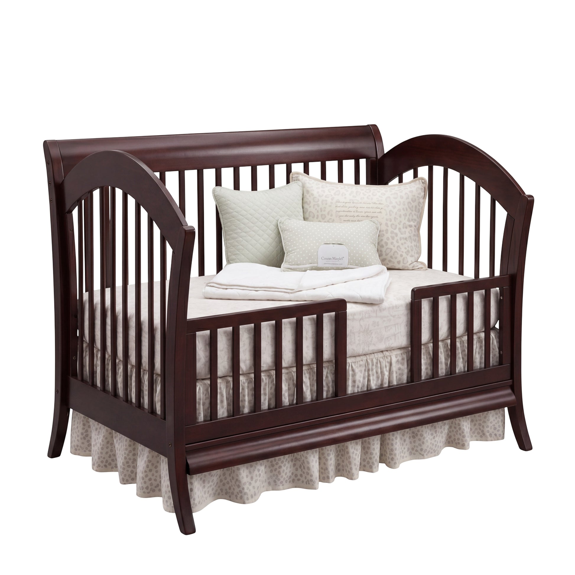Modugreen Baby Laurel conversion kit transforming a dark wood slat crib into a stylish toddler bed with safety rail.