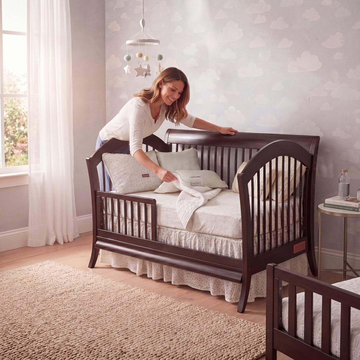 Modugreen Baby Laurel conversion kit transforming a dark wood slat crib into a toddler bed in a cozy nursery.