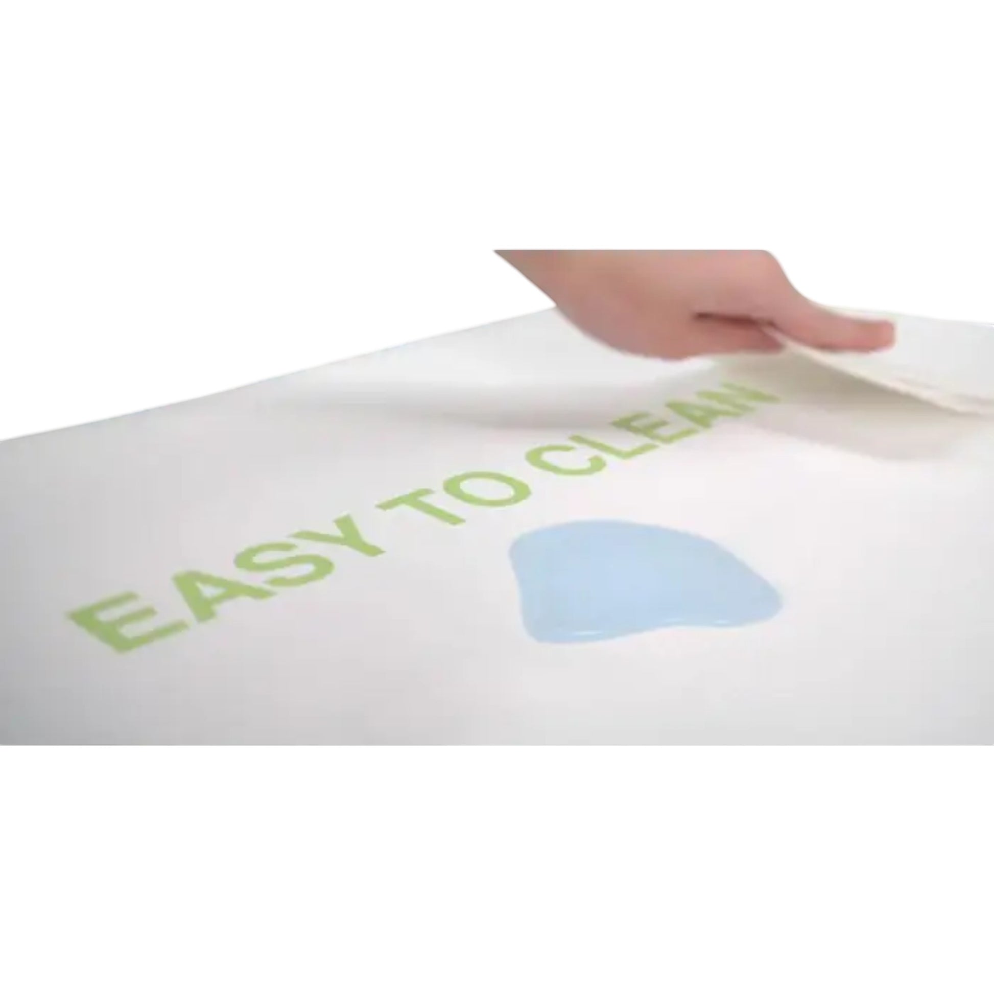 Modugreen Baby Lullaby Earth crib mattress with a waterproof, wipe-clean surface being cleaned by a hand.