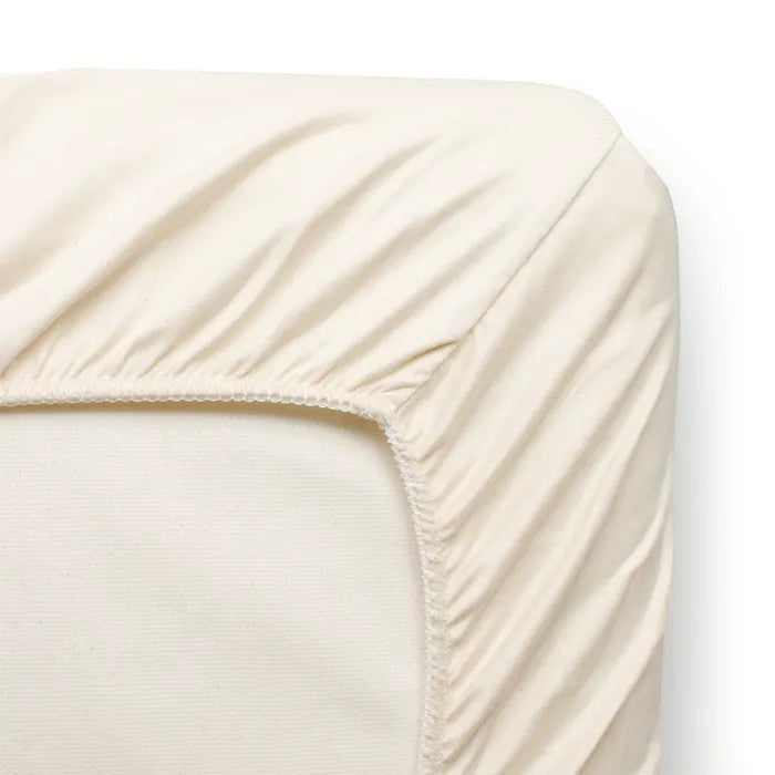 Modugreen Baby ivory organic cotton sateen fitted crib sheet with elastic edges for a secure, smooth fit.